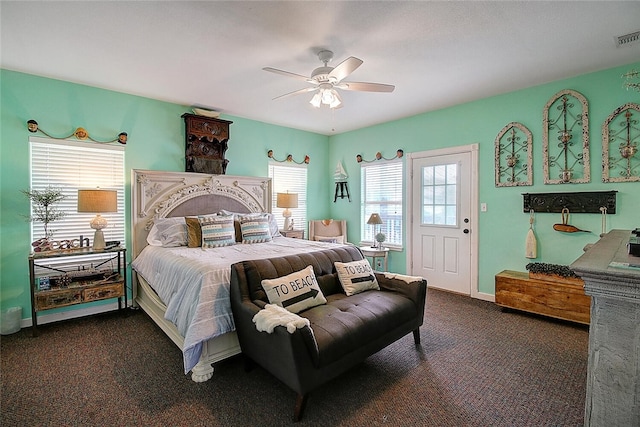 141 Mustang Royale Blvd, Port Aransas, TX 78373 - bedroom with multiple windows, dark colored carpet, and ceiling fan