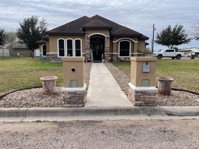 view of front of property with a front lawn