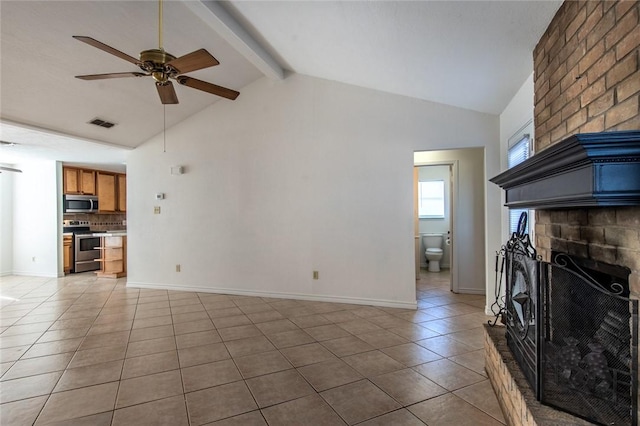 kitchen with appliances with stainless steel finishes, sink, backsplash, tile counters, and a textured ceiling