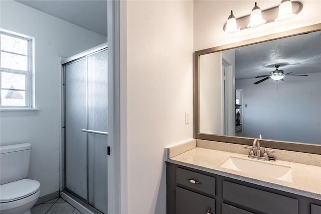 bathroom with toilet and a shower with shower door