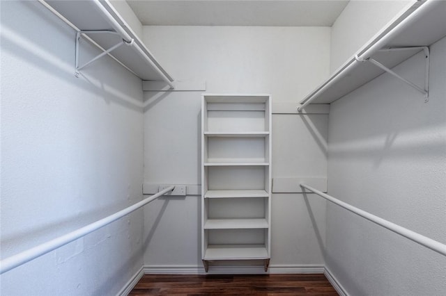 bedroom with ensuite bathroom, wood-type flooring, a textured ceiling, electric panel, and ceiling fan