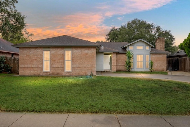 view of front of house with a lawn