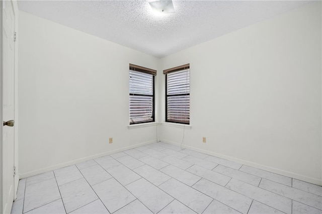 2991 Lakeview E Dr, Ingleside, TX 78362 - spare room with a textured ceiling and baseboards