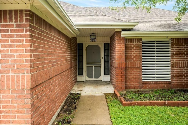 2991 Lakeview E Dr, Ingleside, TX 78362 - property entrance with a shingled roof and brick siding