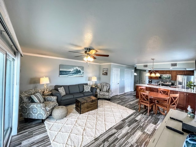 living room featuring crown molding, dark wood-style floors, and a ceiling fan