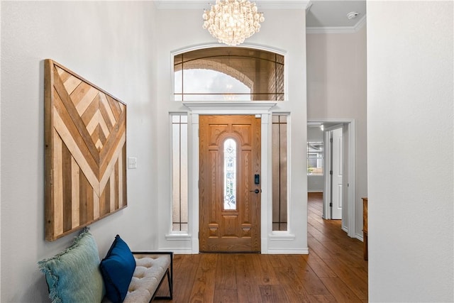 2718 Yeager Dr, Corpus Christi, TX 78410 - entrance foyer with hardwood / wood-style flooring, a chandelier, a high ceiling, and ornamental molding