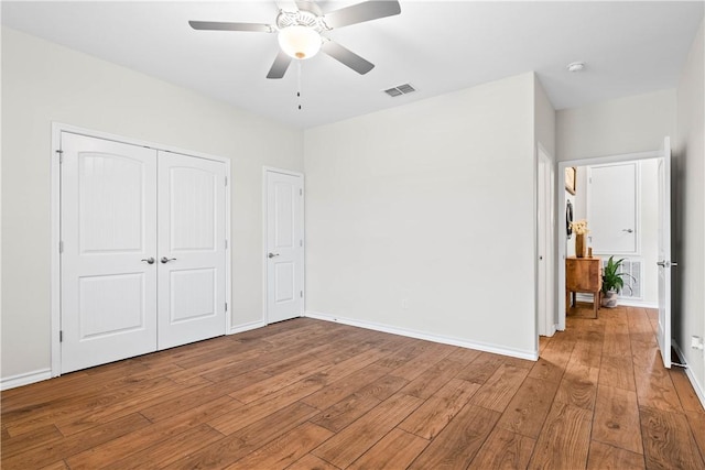 2718 Yeager Dr, Corpus Christi, TX 78410 - unfurnished bedroom featuring wood-type flooring, a closet, and a ceiling fan