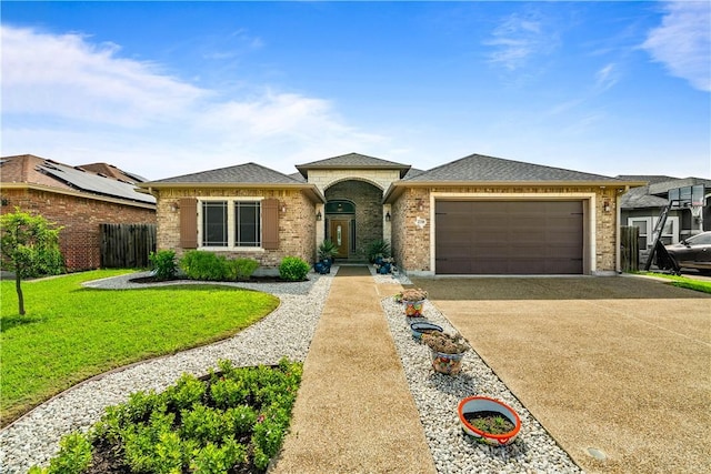 2718 Yeager Dr, Corpus Christi, TX 78410 - view of front facade featuring an attached garage, driveway, brick siding, and a shingled roof