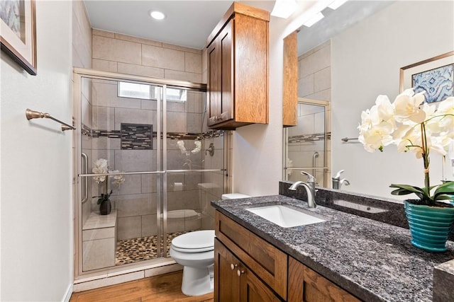 2718 Yeager Dr, Corpus Christi, TX 78410 - bathroom featuring vanity, a shower stall, wood finished floors, and recessed lighting