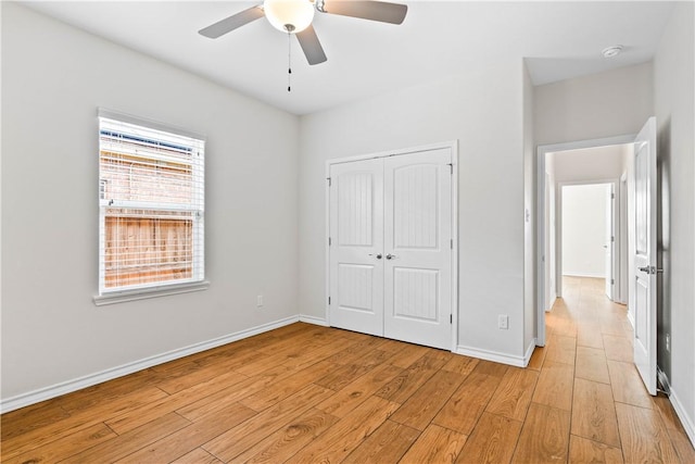 2718 Yeager Dr, Corpus Christi, TX 78410 - unfurnished bedroom with light wood finished floors, a closet, and a ceiling fan