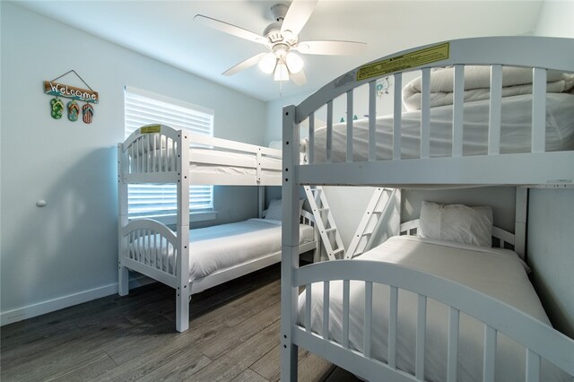 bedroom with wood-type flooring and ceiling fan