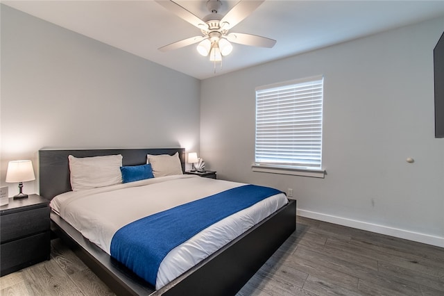 bedroom featuring hardwood / wood-style flooring and ceiling fan