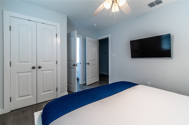 bedroom featuring a closet, ceiling fan, and dark hardwood / wood-style floors