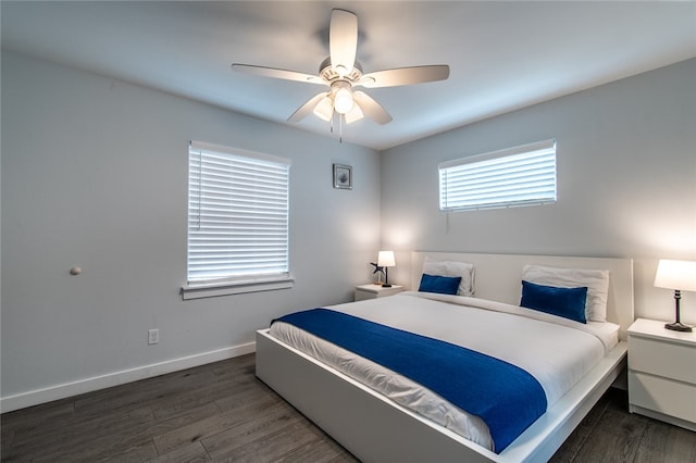 bedroom featuring dark wood-type flooring and ceiling fan