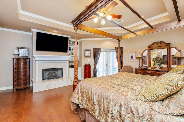 5030 S Oso Pkwy, Corpus Christi, TX 78413 - bedroom with wood finished floors, a high end fireplace, crown molding, and a ceiling fan
