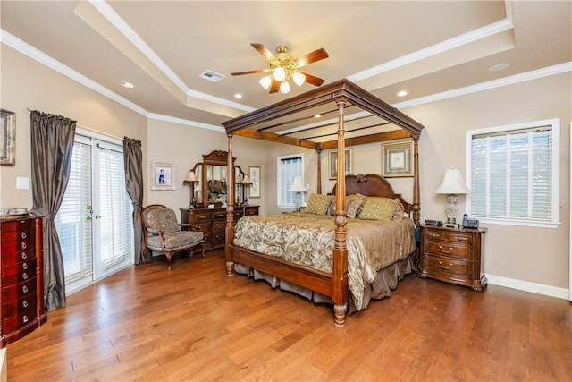 5030 S Oso Pkwy, Corpus Christi, TX 78413 - bedroom featuring a tray ceiling, wood finished floors, access to exterior, crown molding, and recessed lighting