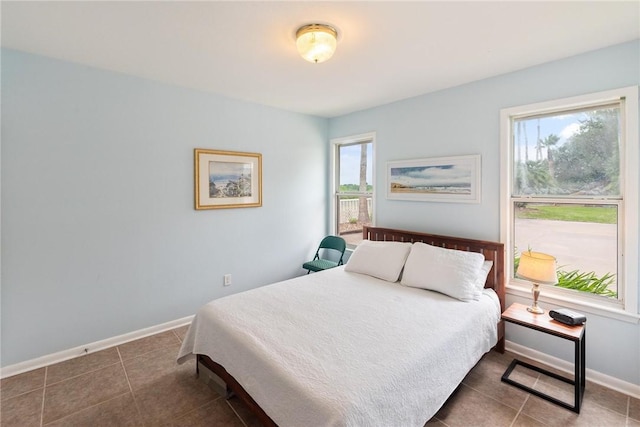 8018 Saint Laurent Dr, Corpus Christi, TX 78414 - bedroom with dark tile patterned floors and baseboards