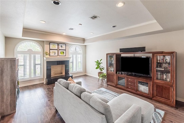8018 Saint Laurent Dr, Corpus Christi, TX 78414 - living room with a tray ceiling, baseboards, healthy amount of natural light, wood finished floors, and recessed lighting