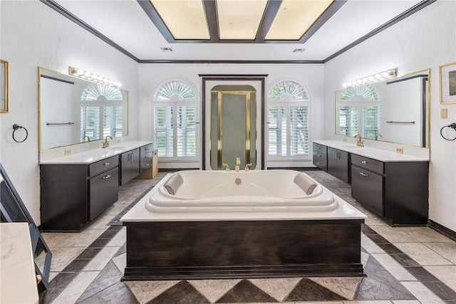 8018 Saint Laurent Dr, Corpus Christi, TX 78414 - full bathroom with crown molding, plenty of natural light, a bath, and two vanities