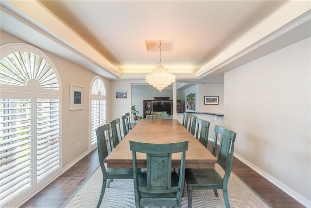 8018 Saint Laurent Dr, Corpus Christi, TX 78414 - dining room with a raised ceiling, a chandelier, baseboards, and wood finished floors