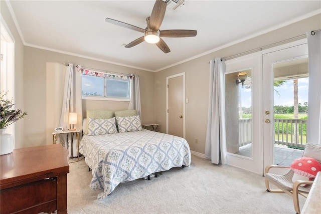 8018 Saint Laurent Dr, Corpus Christi, TX 78414 - carpeted bedroom featuring access to exterior, multiple windows, crown molding, a ceiling fan, and french doors