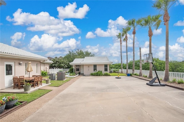 8018 Saint Laurent Dr, Corpus Christi, TX 78414 - exterior space featuring central AC unit, fence, and stucco siding