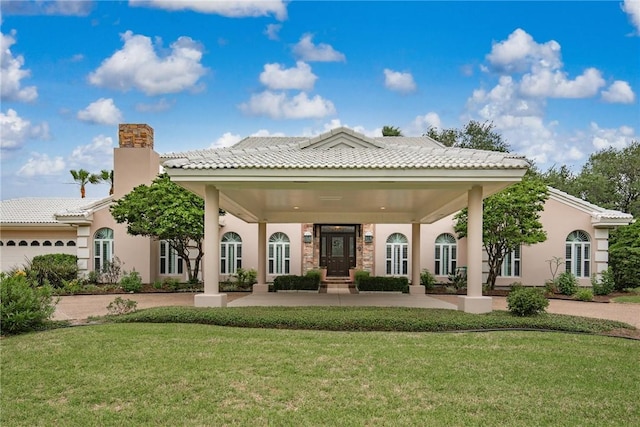8018 Saint Laurent Dr, Corpus Christi, TX 78414 - rear view of house featuring a yard, a chimney, and stucco siding