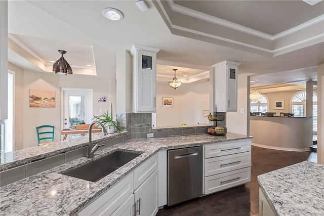 8018 Saint Laurent Dr, Corpus Christi, TX 78414 - kitchen with a tray ceiling, dishwasher, ornamental molding, a sink, and white cabinets