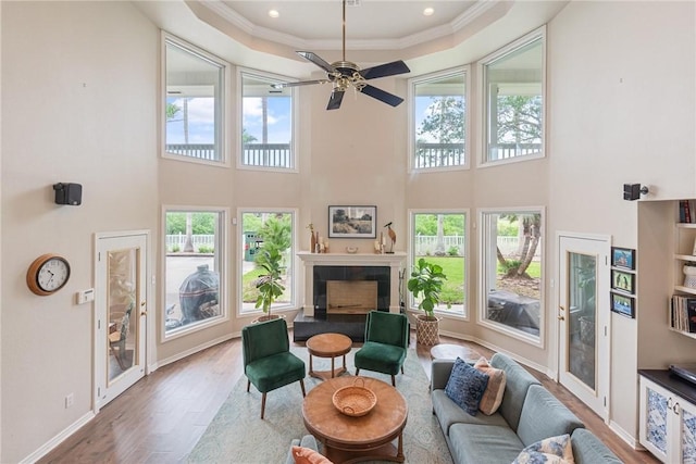 8018 Saint Laurent Dr, Corpus Christi, TX 78414 - living room with wood finished floors, healthy amount of natural light, a towering ceiling, ceiling fan, and ornamental molding
