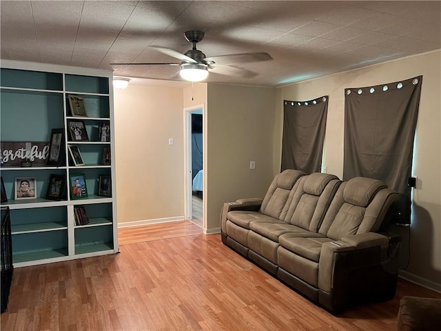 living room featuring hardwood / wood-style flooring and ceiling fan