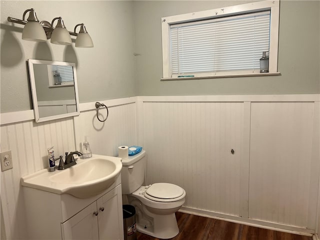 bathroom featuring hardwood / wood-style flooring, vanity, and toilet