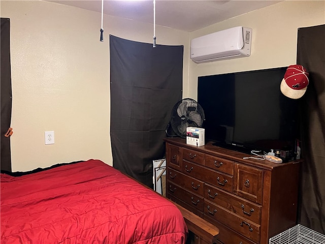 bedroom with a wall mounted air conditioner