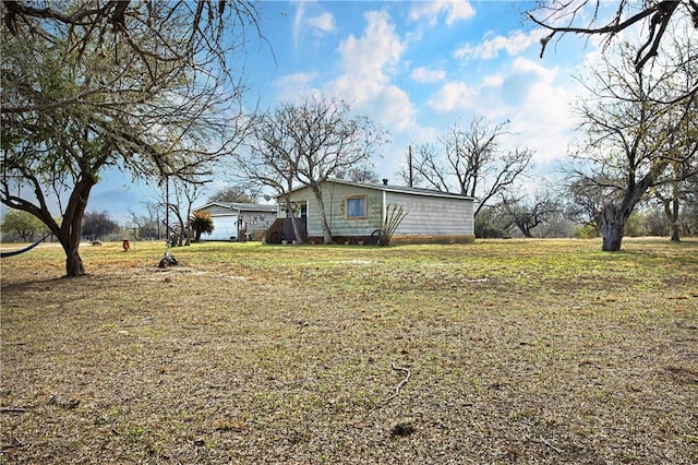 view of home's exterior featuring a lawn