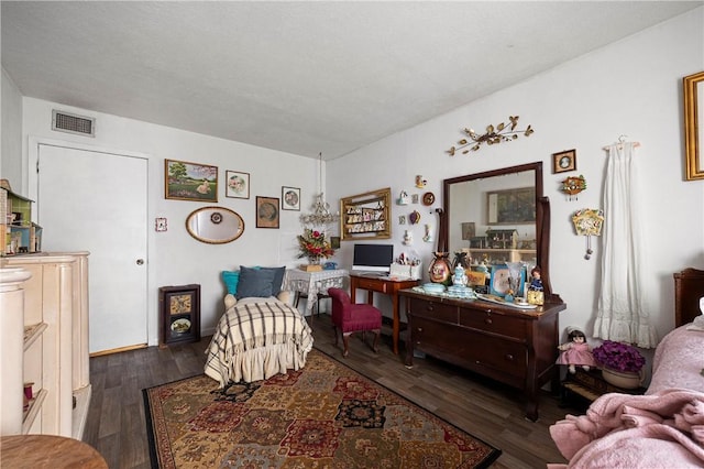 sitting room with dark wood-type flooring