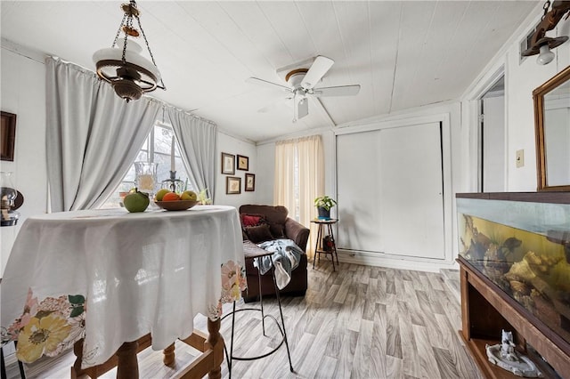 living area with light wood-type flooring, wooden ceiling, and ceiling fan