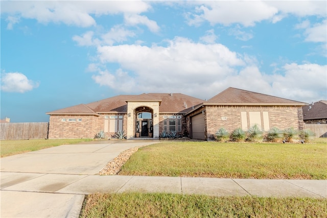 view of front facade with a front lawn and a garage