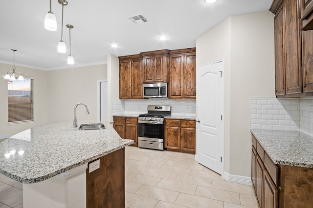 kitchen with crown molding, appliances with stainless steel finishes, hanging light fixtures, an inviting chandelier, and sink