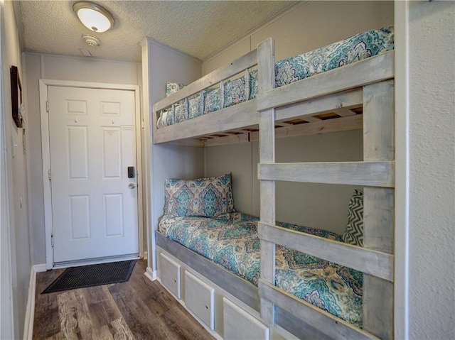 3938 Surfside Blvd Unit 3344, Corpus Christi, TX 78402 - bedroom featuring wood finished floors and a textured ceiling