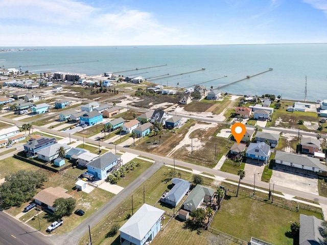 bird's eye view featuring a residential view and a water view