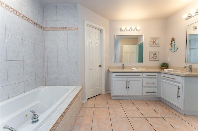 103 E Palmetto Dr Unit B, South Padre Island, TX 78597 - full bath with double vanity, a garden tub, and tile patterned floors
