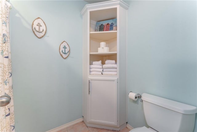 103 E Palmetto Dr Unit B, South Padre Island, TX 78597 - bathroom with toilet and tile patterned floors