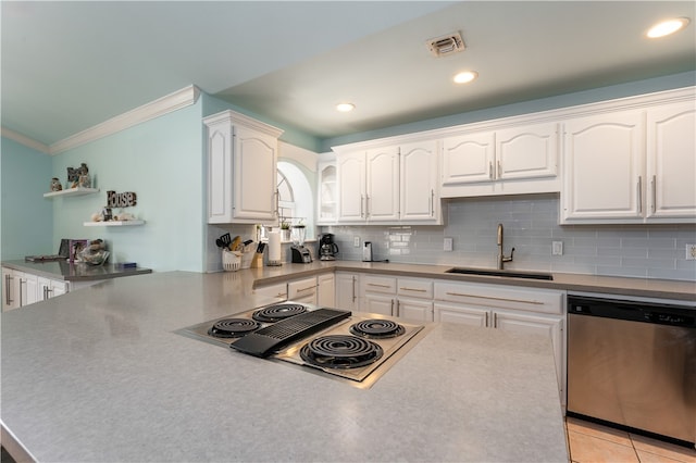 kitchen featuring ornamental molding, stainless steel appliances, decorative backsplash, sink, and white cabinets