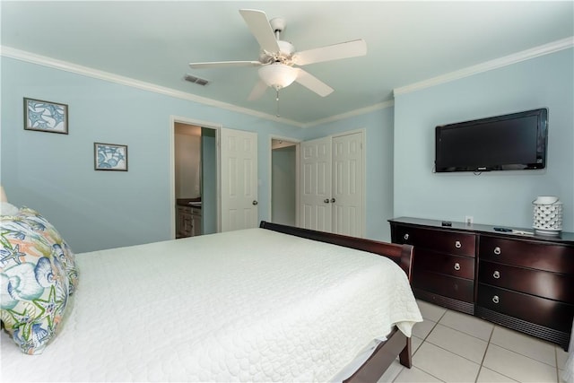 103 E Palmetto Dr Unit B, South Padre Island, TX 78597 - bedroom featuring crown molding, a closet, light tile patterned floors, ceiling fan, and ensuite bath