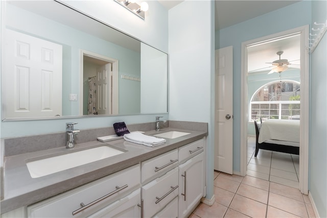 bathroom featuring tile patterned flooring, vanity, and ceiling fan