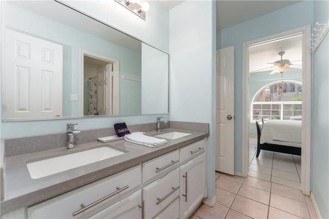 103 E Palmetto Dr Unit B, South Padre Island, TX 78597 - bathroom featuring double vanity, tile patterned flooring, connected bathroom, and ceiling fan