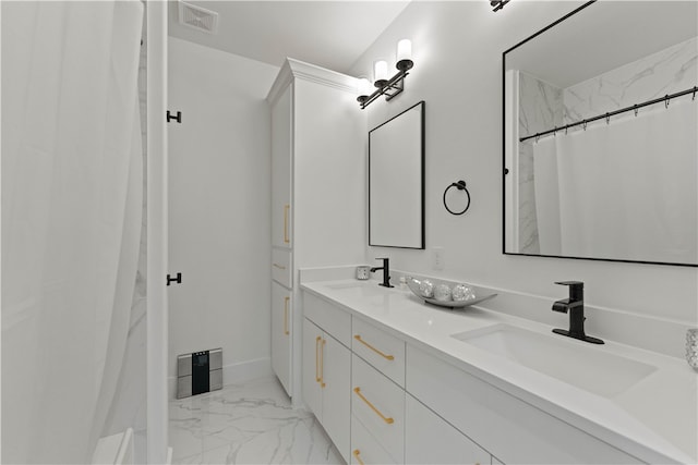 bathroom featuring vanity and a shower with shower curtain