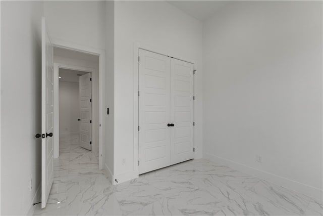 unfurnished bedroom with a closet