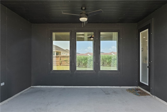 interior space featuring ceiling fan