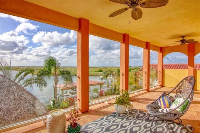 view of patio with a water view