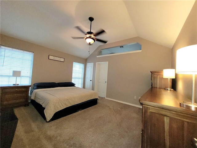 2022 Jenica Dr, Ingleside, TX 78362 - bedroom featuring vaulted ceiling, light colored carpet, multiple windows, baseboards, and ceiling fan